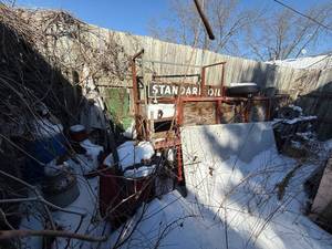 lot 101 image: Collection of Antique Standard Oil Signs and Industrial Equipment