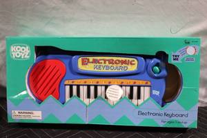lot 123 image: Kool Toyz Electronic Keyboard for Ages 3 and Up