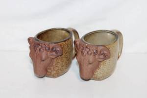 lot 229 image: Set of 2 Ram Head Ceramic Mugs with Textured Finish