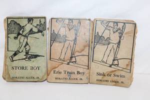 lot 237 image: Set of 3 Vintage Horatio Alger Jr. Books Store Boy, Erie Train Boy, Sink or Swim