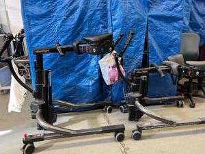lot 39 image: 2 Rifton Trams - No Batteries - For Parts Only
