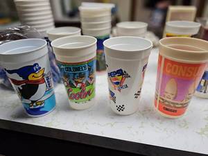 lot 111 image: Vintage Plastic Advertising Cups