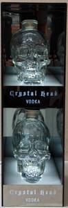 lot 34 image: Crystal Head Vodka Display (Lights Up) - (2) Skull Bottles (Empty) (1) Stand that Lights Up (View Photos)