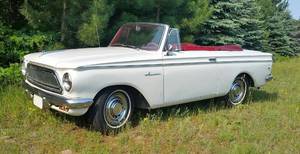 lot 5 image: Eye Catching 1963 Rambler American Convertible - White Exterior w Vibrant Red Interior