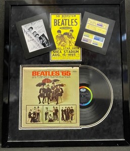 lot 428 image: The Beatles 65 Framed Vinyl Record Display