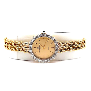 lot 219 image: Baume & Mercier 14k Yellow Gold Watch with 12 Carat Natural Diamonds $2,500 - $3,500 Estimate VIDEO