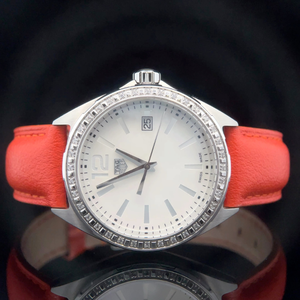 lot 214 image: Tag Heuer Formula 1 Diamond Bezel Ladies Watch with Orange Leather Strap  With Box & Papers $1,400 - $2,000 Estimate VIDEO