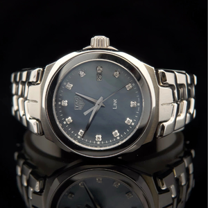 lot 215 image: Tag Heuer Link Lady Diamond Watch with Blue Mother-of-Pearl Dial  With Box & Papers $1,500 - $2,000 Estimate VIDEO