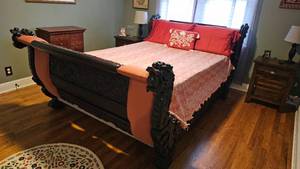 lot 4 image: Johnny Cash Owned  Ornately Carved Dragon Motif Sleigh Bed from His Personal Wardrobe Room $20,000 - $30,000 Estimate