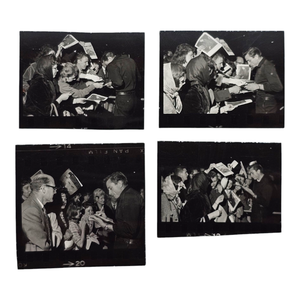 lot 72 image: Group of 4 Original Johnny Cash Contact Photo Sheet Segments  Signing Frenzy with Fans