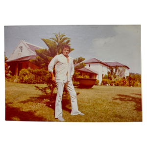 lot 82 image: Johnny Cash in White Outside Jamaican Home  Original Photograph $3,500 - $5,000 Estimate 
