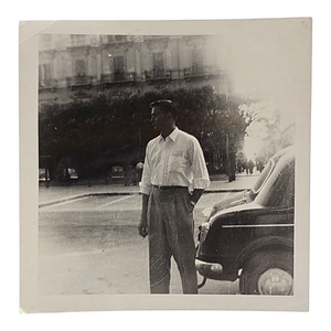 lot 78 image: Johnny Cash Early Original Photo  Standing by Car in Europe $2,500 - $4,000 Estimate 