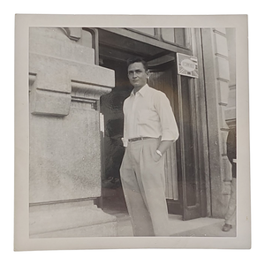 lot 77 image: Early Original Photo of Johnny Cash Standing Outside British Forces Office $3,000 - $5,000 Estimate 