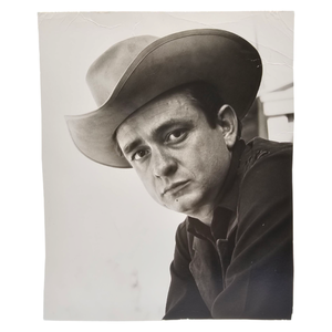 lot 89 image: Early Promotional Photo of Johnny Cash by Leigh Wiener $4,000 - $6,500 Estimate 