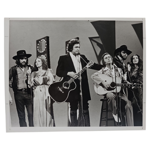 lot 93 image: Johnny Cash with June Carter Cash, George Jones, Waylon Jennings, Hank Williams Jr., and Anita Carter - CBS Internal Photograph, 1979 Spring Special $3,500 - $6,000 Estimate 