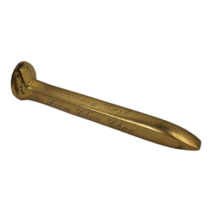 lot 112 image: Johnny Cash Owned  Personalized Golden Railroad Spike from the City of Chattanooga $5,000 - $8,000 Estimate 
