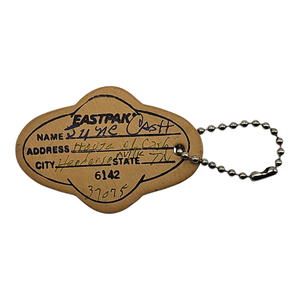 lot 135 image: June Carter Cash Owned  Handwritten Luggage Tag  House of Cash, Hendersonville, TN