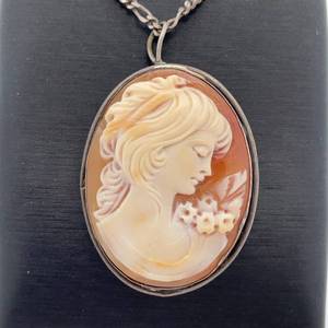 lot 255B image: Cindy Cash Owned  1940s Sterling Silver Antique Cameo of a Lady Looking at Flowers - Pin and Pendant Convertible VIDEO