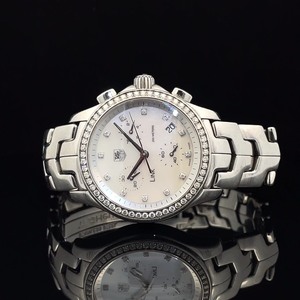 lot 216B image: Tag Heuer Mother of Pearl Diamond Bezel Ladies Chronograph Wristwatch $1,200 - $1,600 Estimate VIDEO
