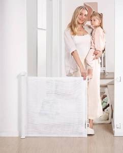 lot 104 image: Brand New Likzest Retractable Baby Gate $49.99 Retail B