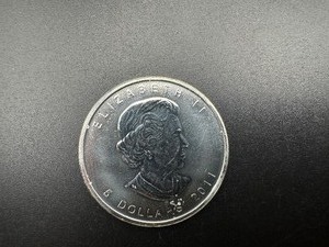 lot 53 image: 2011 Brilliant Uncirculated .9999 1 Oz. Silver Canada Maple Leaf