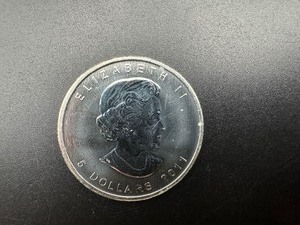 lot 54 image: 2011 Brilliant Uncirculated .9999 1 Oz. Silver Canada Maple Leaf