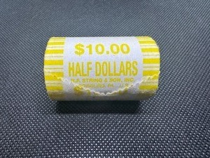 lot 99 image: Sealed Fed Roll Half Dollars