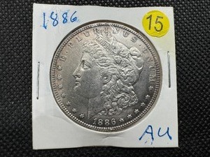 lot 15 image: 1886 Morgan Silver Dollar AU