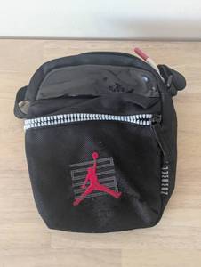 lot 34 image: Air Jordan- Cross Body Bag - Black