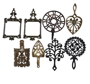 lot 227 image: Eight Vintage Metal Trivets and One Ceramic Trivet