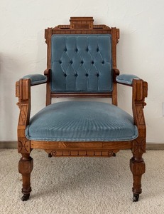 lot 48 image: Antique Carved Victorian Walnut Arm Chair  Upholstered Blue Parlor Armchair