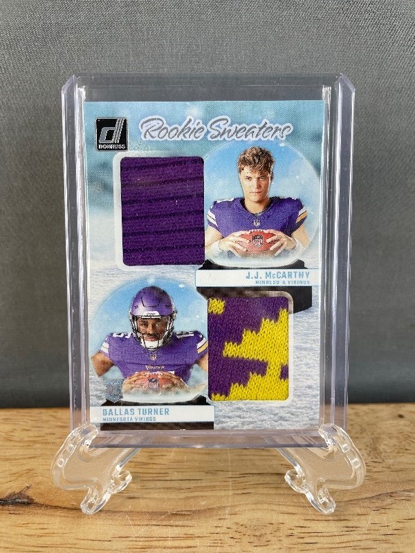 lot 46 image: 2024 Panini Donruss JJ McCarthy, Dallas Turner Rookie Sweaters #RHD-MIN T