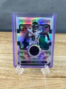 lot 119 image: 2021 Panini Prizm Elijah Moore Silver Prizm Rookie Gear Patch #RG-16 J
