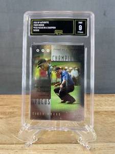 lot 31 image: 2001 SP Authentic Tiger Woods Focus on a Champion Rookie #FC5 Graded GMA Mint 9 J