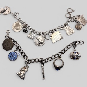 lot 108 image: Lot of Two Silver Tone Charm Bracelets, Some Sterling -Albert Lea High School Class Ring Charm