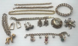 lot 56 image: Gold Charm Bracelet, Poodle Bracelet and Amber Rhinestone Brooches