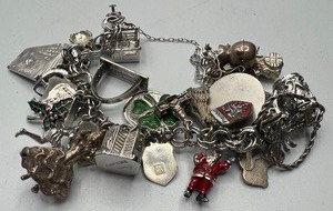 lot 127 image: Elco Sterling Silver Charm Bracelet FULL with Charms Intl Travel, Santa Claus, Mayo Clinic