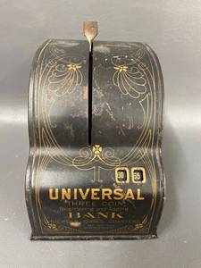 lot 12 image: Universal Three Coin Bank 1915