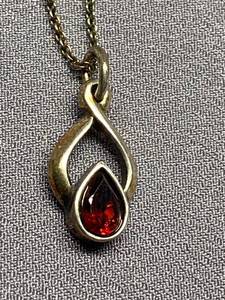 lot 24B image: Sterling Silver Flame Pendant Necklace with Red Gem