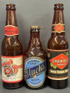 lot 63 image: Vintage Yoergs Glueks Grain Belt Beer Bottles