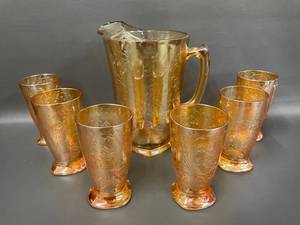 lot 152 image: Jeannette Carnival Glass Pitcher & 6 Glasses Set