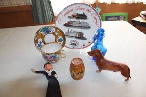 lot 38 image: Assorted Vintage Collectibles Cup and Saucer Set, Decorative Plate, Blue Glass Vase, and Figurines