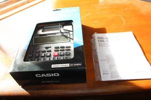 lot 142 image: Casio HR-100TM Plus Printing Calculator with Users Guide