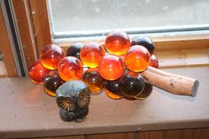 lot 223 image: Vintage Amber and Black Glass Grape Cluster with Wooden Stem and Owl Figurine