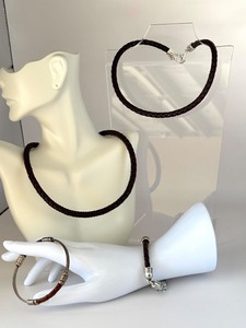 lot 42J image: Two Braided Leather Necklaces and Two Bracelets