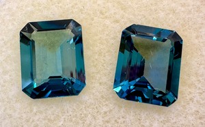 lot 44J image: Pair of London Blue Topaz Emerald Cut Gemstones