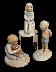 lot 54 image: A Childs World Figurines by Francis Hook including All Dressed Up, Bear Hug and The Sea & Me