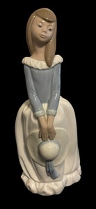 lot 160 image: Lladro NAO Girl Holding Hat Figurine