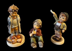 lot 100 image: Three Vintage Hummel Figurines Hummel The Little Doctor Figurine #127 West Germany, Goebel M.I. Hummel Come Back Soon, Shepherd with Flute