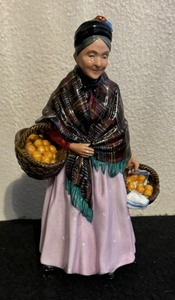 lot 606 image: Royal Doulton The Orange Lady Figurine HN 1754